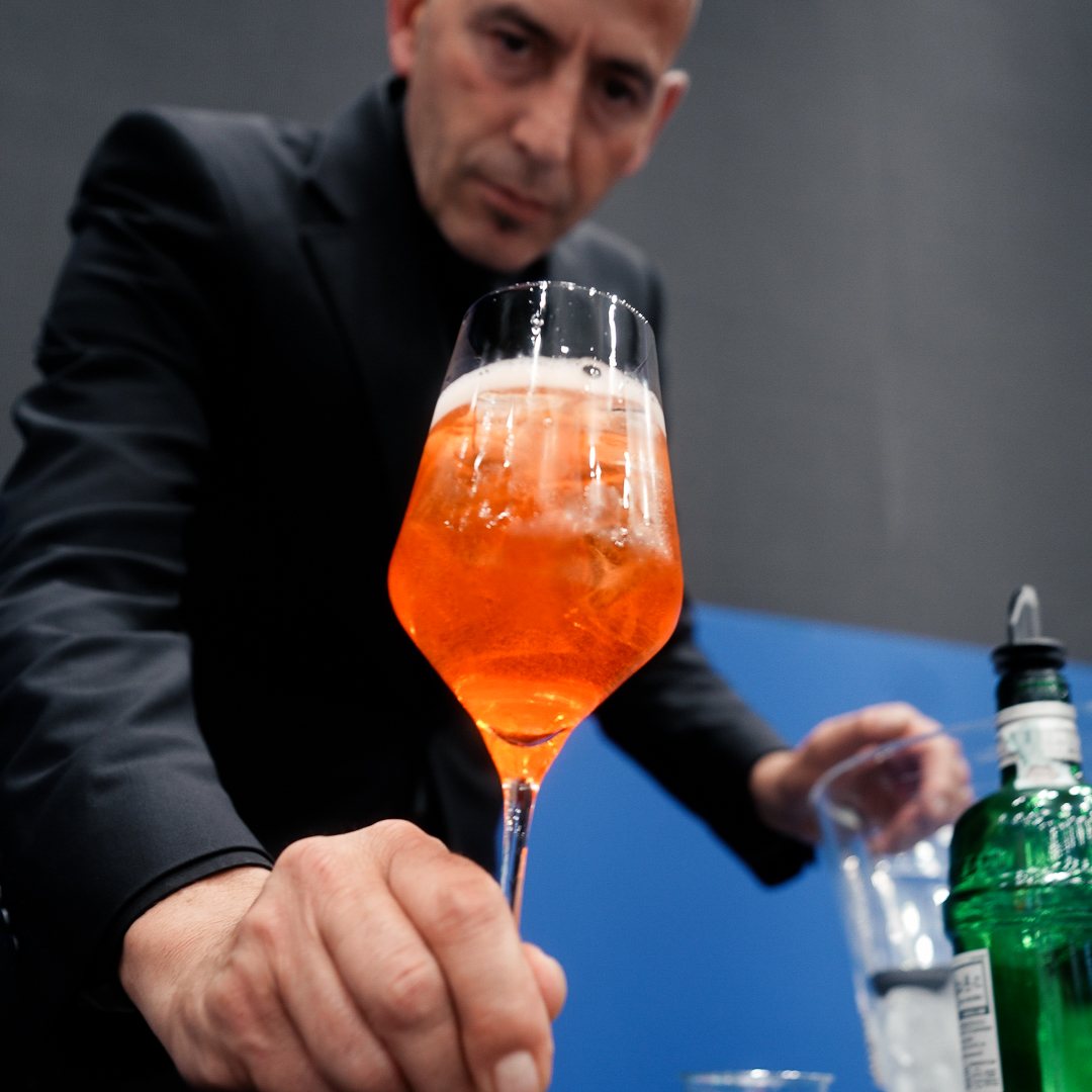 Bartender serving a Spritz at a corporate event